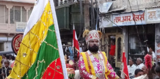A performer posing as Baba Ram Dev at Ramdevra Fair.