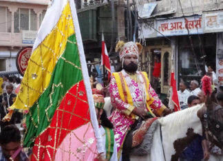 A performer posing as Baba Ram Dev at Ramdevra Fair.